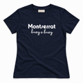 A navy blue short-sleeve crewneck t-shirt with 'Montserrat buoy o buoy' printed in white across the chest, displayed flat against a clean white background.